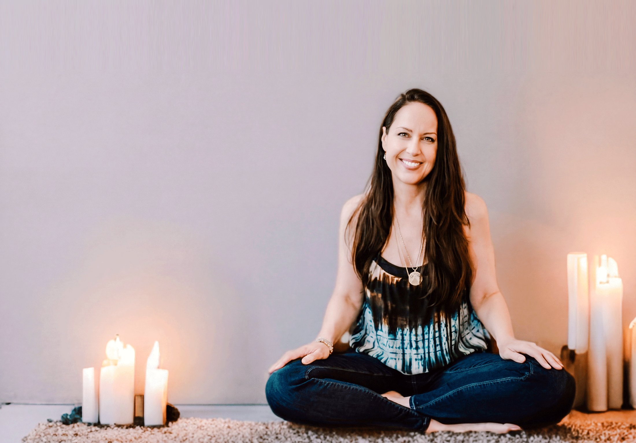 Alyssa Malehorn seated in candlelight
